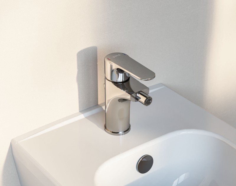 Chrome coloured Root Bidet Mixer with pop-up on a white bidet