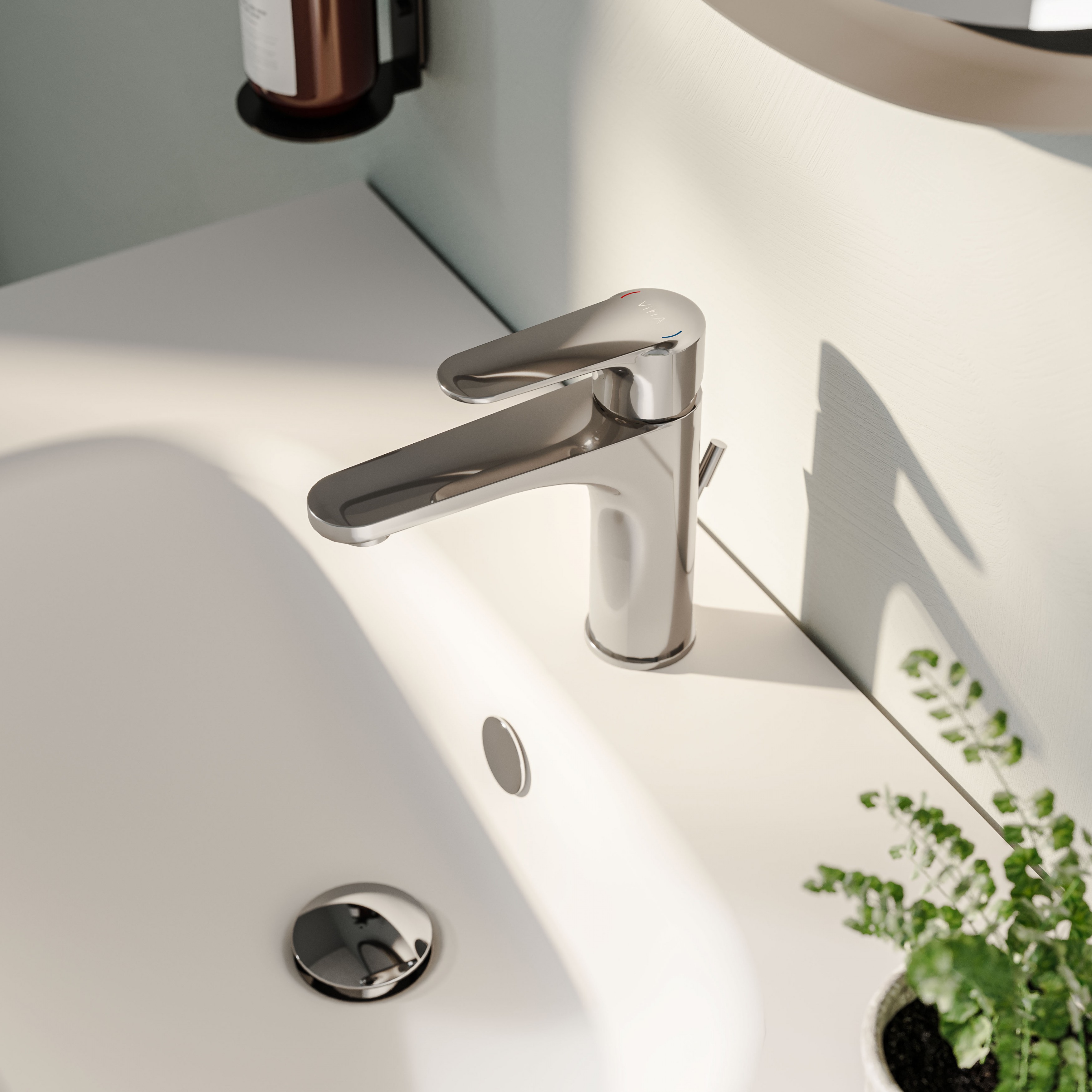 VitrA's chrome coloured root round taps on a white Zentrum washbasin
